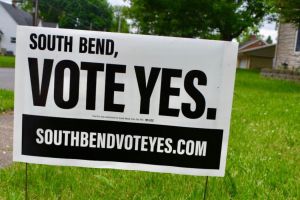 A South Bend Schools yard sign from its 2020 referenda. It reads South Bend, vote yes in black letters and directs people to a website. 