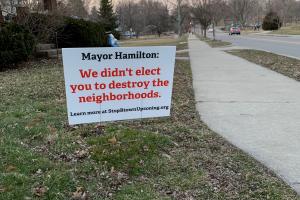 A photo of a sign that says "Mayor Hamilton we didn't elect you to destroy our neighborhoods."