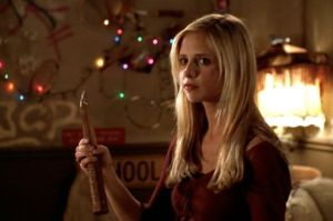 Buffy the Vampire Slayer holding a wooden stake.