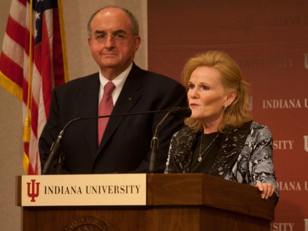 IU president Michael McRobbie looks on as Higher Education Commissioner Teresa Lubbers speaks during a press conference on Monday, October 24 in Indianapolis. McRobbie was announcing a 25 percent summer semester tuition discount for in-state undergraduate students.