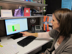 Bloomington educator Nancy Fisher looks at a computer graph summarizing student data.