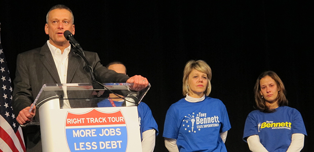 With family members looking on tearfully, Republican state superintendent Tony Bennett concedes the race for the state's top school official to Democrat Glenda Ritz.