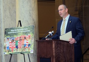 Sen. Scott Schneider, R-Indianapolis, speaks at a rally at the statehouse in January. After his initial proposal to stop Common Core implementation stalled, Schneider attached 'pause' language to another education bill.