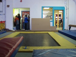 Project Libertas holds classes at Jireh Sports, a church-owned community center and gymnasium in the Martindale-Brightwood neighborhood of Indianapolis. The students use classrooms tucked in between large, open spaces covered with balance beams, tumbling mats and trampolines.