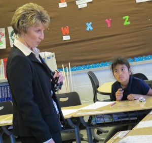 Glenwood Leadership Academy principal Tamara Skinner visits teacher Amber Santana's fourth grade classroom. The school serves students in grades K-8.