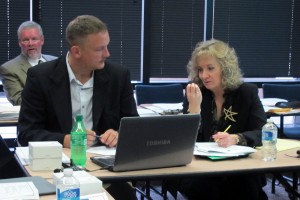 State superintendent Glenda Ritz, right, talks to State Board of Education member B.J. Watts during a strategic planning session on Dec. 3.