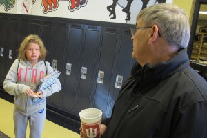 Cannelton City Schools superintendent Al Sibbitt talks to a student in the hallway. He says educating a kid from Cannelton is not necessarily the same as education a student in another Indiana district.