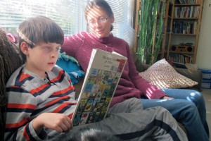 Jenny Robinson reads with her second grade son, Louis. Robinson says she is concerned about the amount of testing her children participate in, and wishes there was more time spent on creative learning.