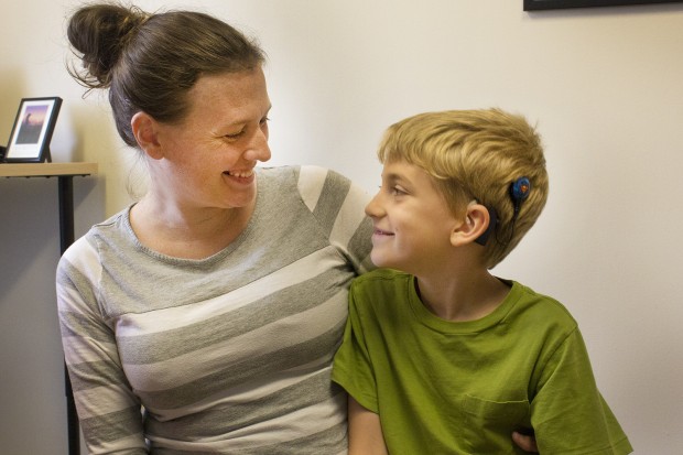 Ellyn McCall and her son Seth 8 at the Hear Indiana offices. (Peter Balonon-Rosen/Indiana Public Broadcasting)
