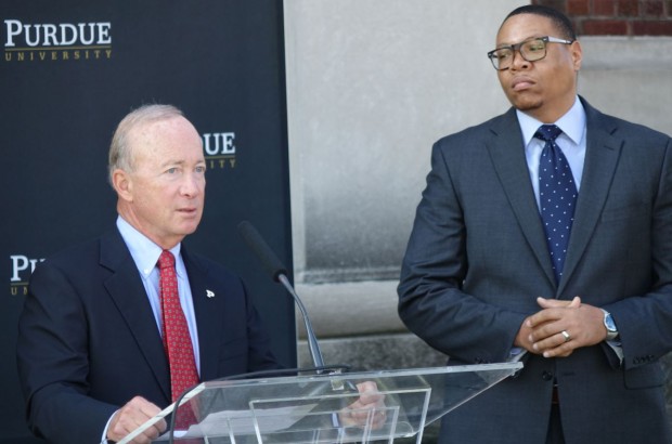 Purdue University President Mitch Daniels discusses the Purdue Polytechnic High School at its future home in the PR Mallory Building, 3029 E. Washington St., on the east side of Indianapolis as Indianapolis Public Schools Superintendent Lewis Ferebee listens on Monday, Oct. 3, 2016. The charter school will be part of the IPS district under a contract that makes IPS accountable for student's state funding and their academic outcomes. (Eric Weddle/WFYI)