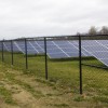 A row of solar panels lies behind Sheridan Elementary School. (Peter Balonon-Rosen/Indiana Public Broadcasting)