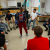 Students in Andy Slater’s science class start the morning by playing a word game. Students jump up to move to an open seat if they agree with what the standing student says – sort of like musical chairs. (Eric Weddle/WFYI)