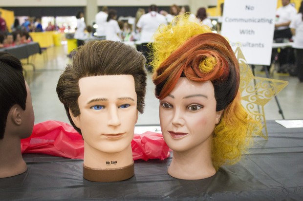 Mannequin heads from the hairstyling competition. (Peter Balonon-Rosen/Indiana Public Broadcasting)