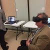 State Sen. Brandt Hershman (R-Buck Creek) tries on an Oculus Rift virtual reality headset at Hope Academy in Indianapolis on Thursday, Aug. 10, 2017. (Eric Weddle/WFYI News)
