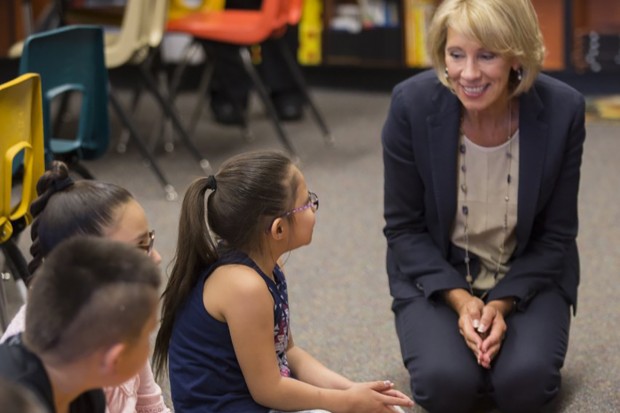 U.S. Education Secretary Betsy DeVos talks with students at St. Stephens Indian School on the Wind River Reservation in Stephens, Wyoming, on September 12. (Photo courtesy: USED)