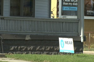 Near East Area Renewal, or NEAR, posts signs on the properties it eventually offers as affordable housing in St. Clair Place. (Steve Burns/WTIU)